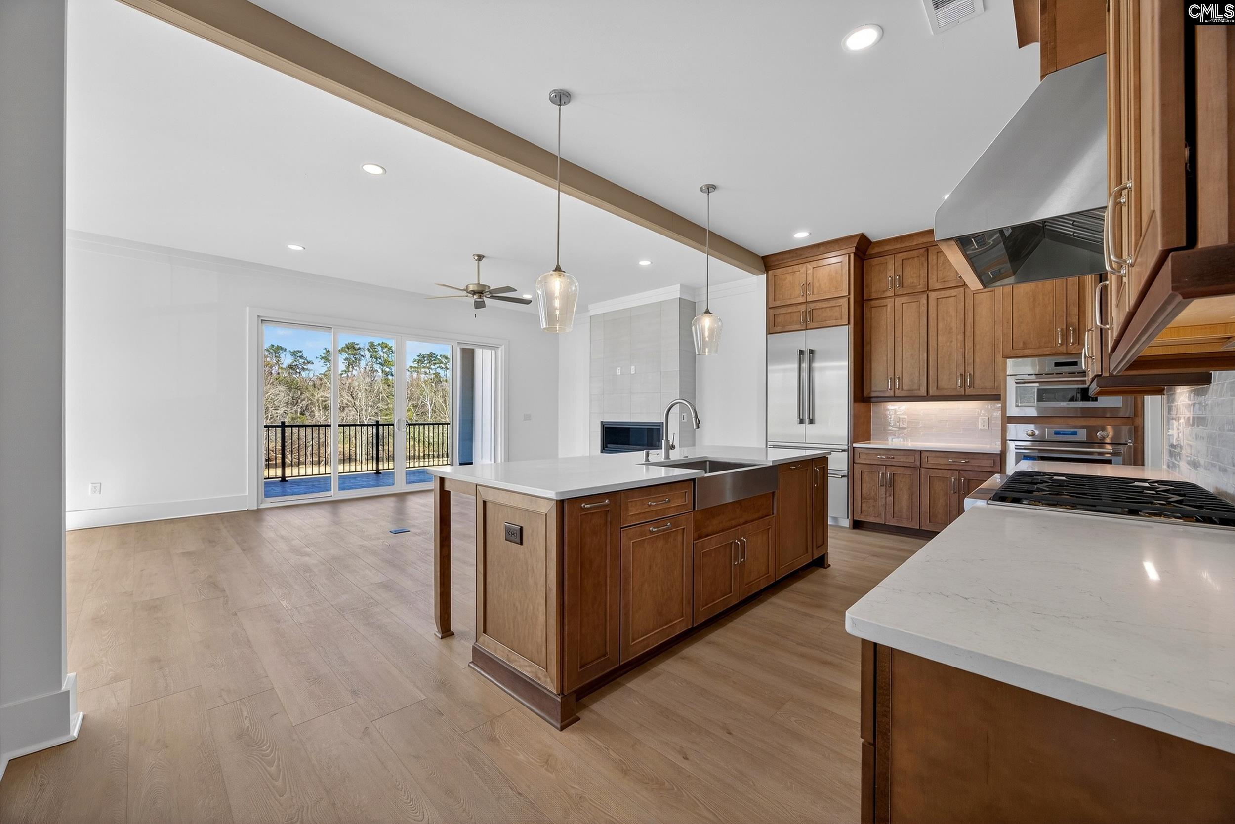 1318 Long Grove Way Lexington, SC 29072 - Photo 2 of 90 a large kitchen with stainless steel appliances wooden floor and a large window