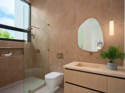 a bathroom with a toilet sink and mirror