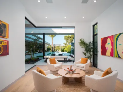 a bedroom with a large bed and a large window