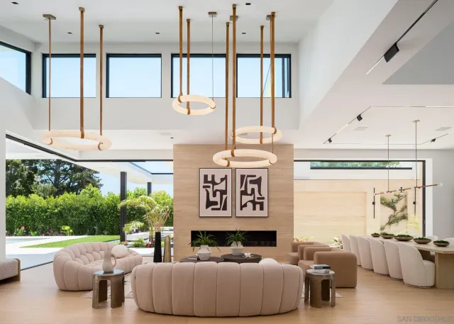 a bedroom with furniture and a large window