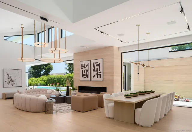 a living room with a couch and a ceiling fan