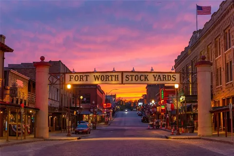 a view of a street with stores
