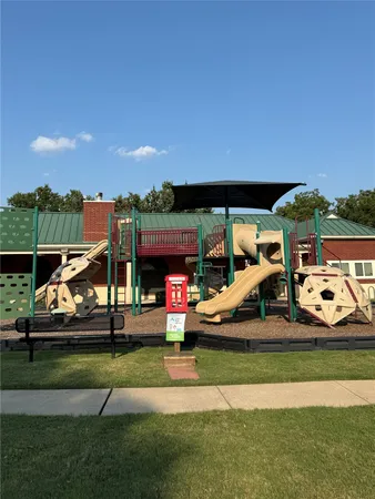 a view of a park with houses