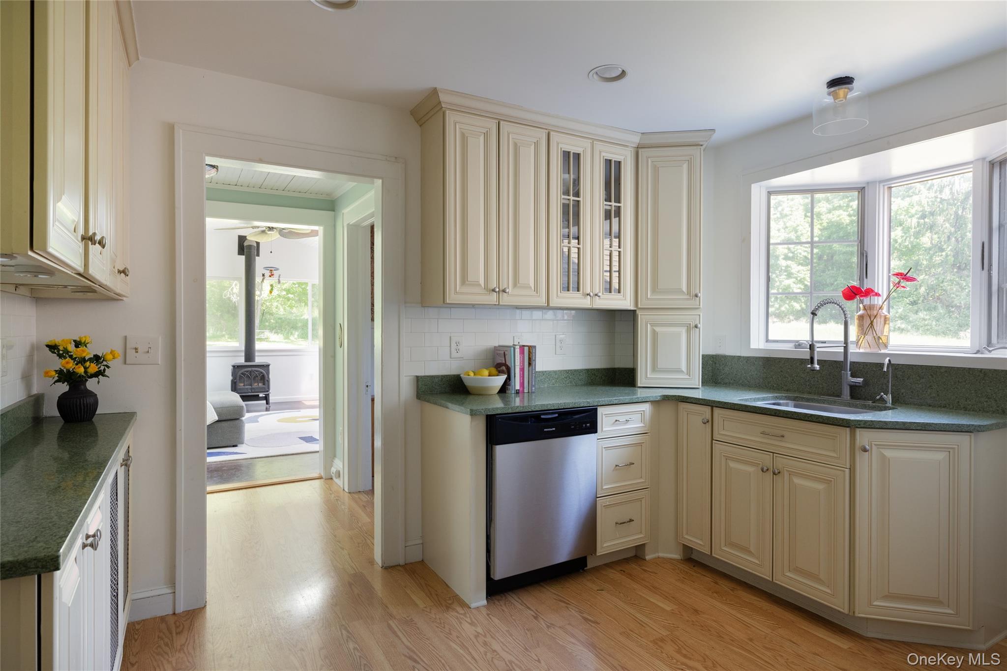 185 Verbank Village Road Millbrook, NY 12545 - Photo 9 of 22 a kitchen with a sink cabinets and wooden floor