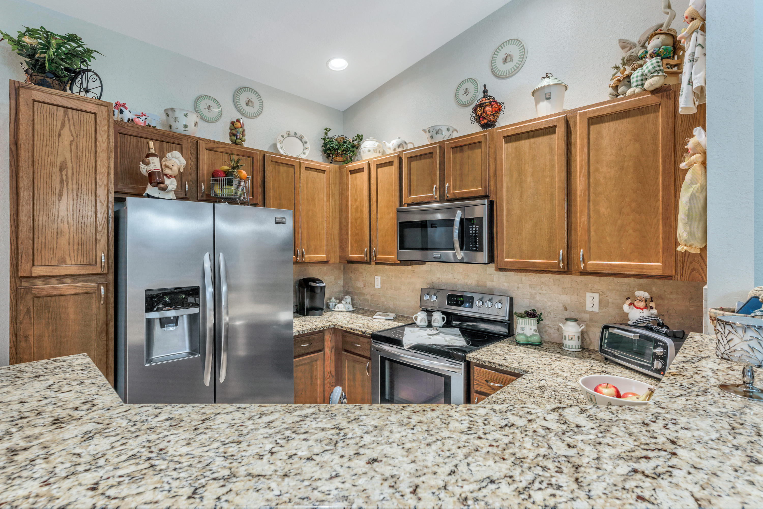 3067 Laurel Ridge Circle Riviera Beach, FL 33404 - Photo 4 of 26 NEW GRANITE COUNTERS WITH WOOD CABINETS
