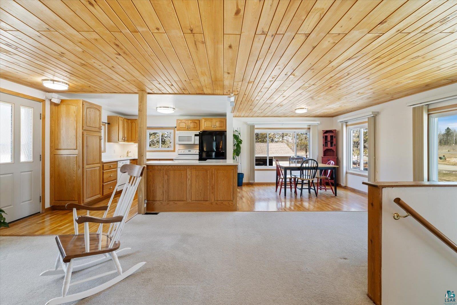 3495 Deer Forest Road Makinen, MN 55763 - Photo 13 of 71 Kitchen with wooden ceiling, light countertops, plenty of natural light, white appliances, and light wood-style floors