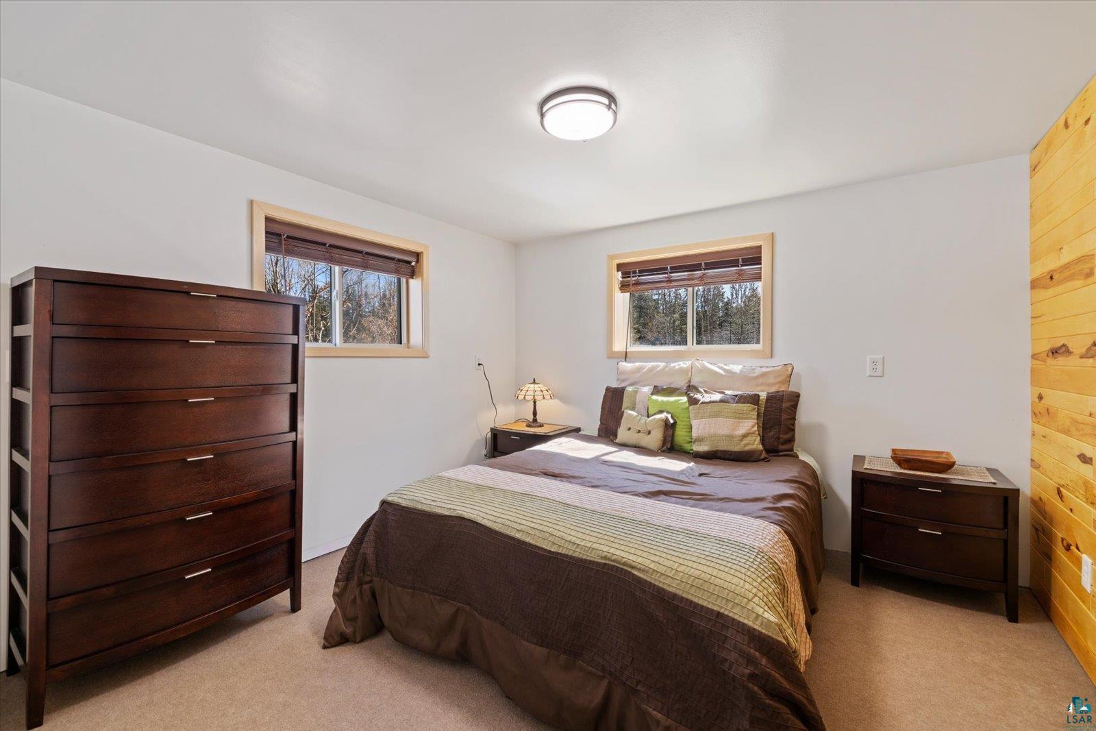 3495 Deer Forest Road Makinen, MN 55763 - Photo 17 of 71 Bedroom with multiple windows and light carpet
