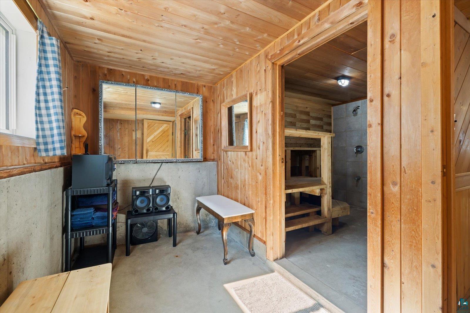 3495 Deer Forest Road Makinen, MN 55763 - Photo 19 of 71 Sauna with concrete flooring and wooden ceiling