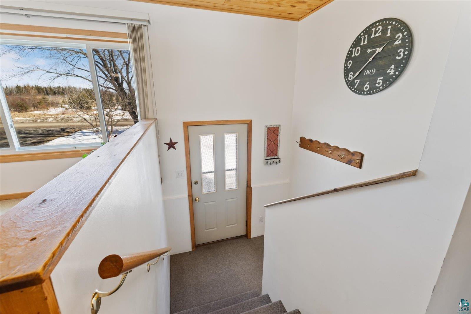 3495 Deer Forest Road Makinen, MN 55763 - Photo 21 of 71 Foyer entrance with light carpet and wood ceiling