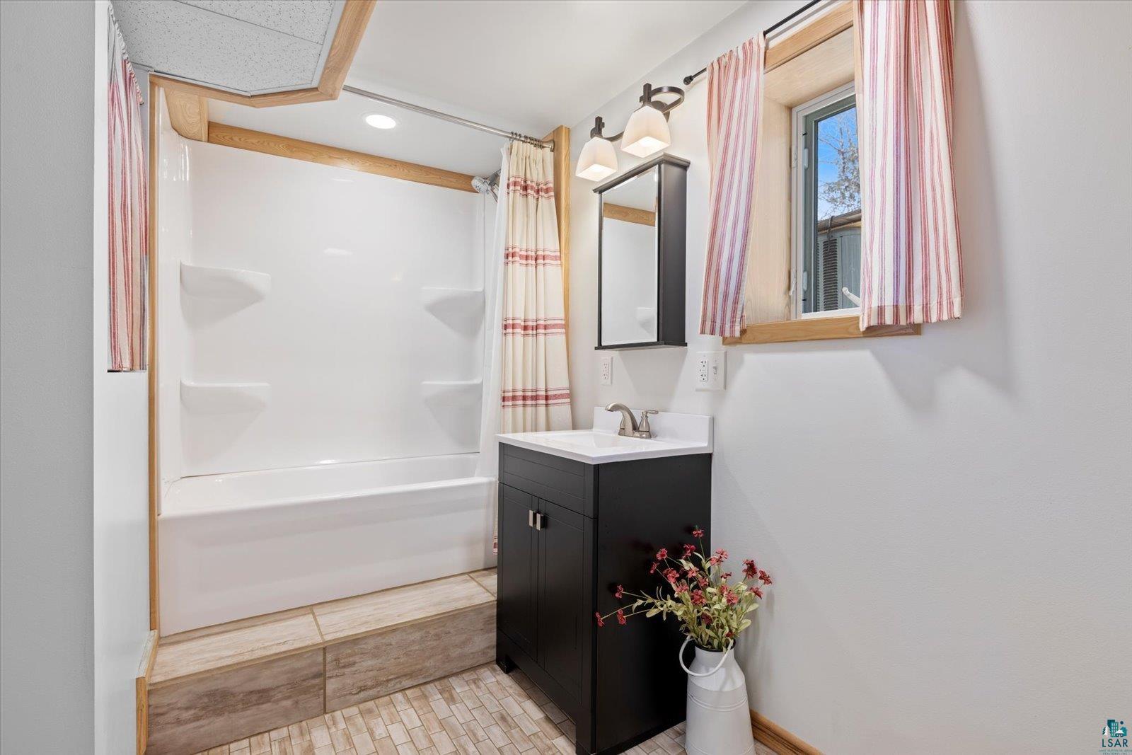 3495 Deer Forest Road Makinen, MN 55763 - Photo 22 of 71 Full bath featuring vanity, shower / bath combo with shower curtain, and recessed lighting