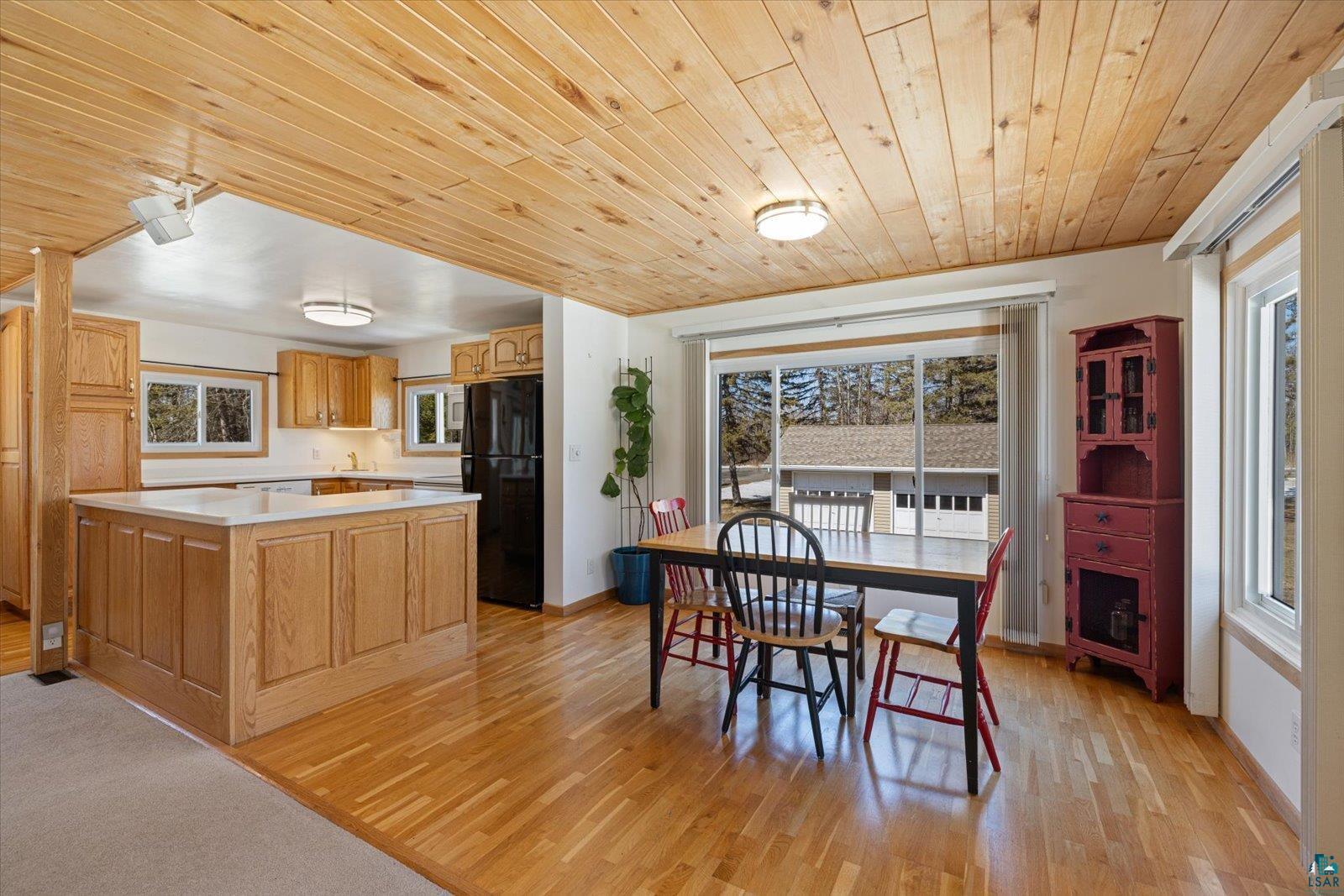 3495 Deer Forest Road Makinen, MN 55763 - Photo 3 of 71 Dining space featuring light wood-style floors, plenty of natural light, and wooden ceiling