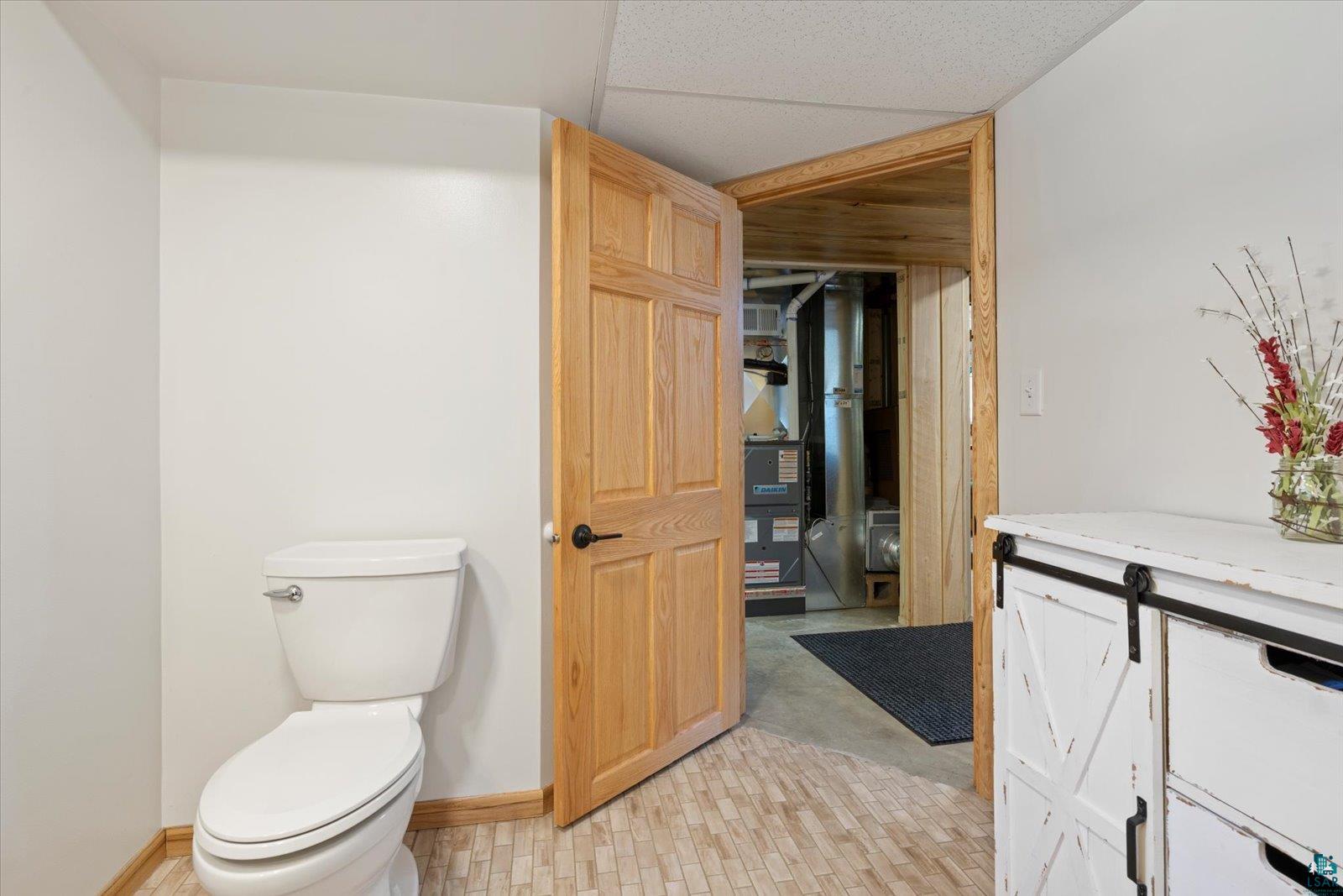 3495 Deer Forest Road Makinen, MN 55763 - Photo 32 of 71 Bathroom featuring vanity and heating unit