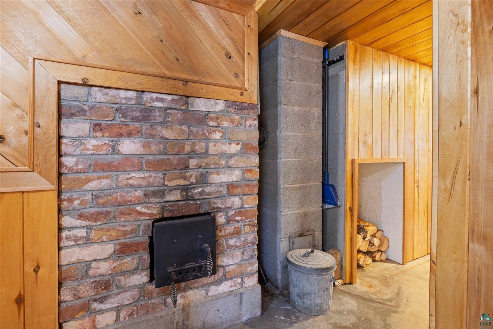3495 Deer Forest Road Makinen, MN 55763 - Photo 50 of 71 Detailed view of wood walls, wooden ceiling, and unfinished concrete flooring