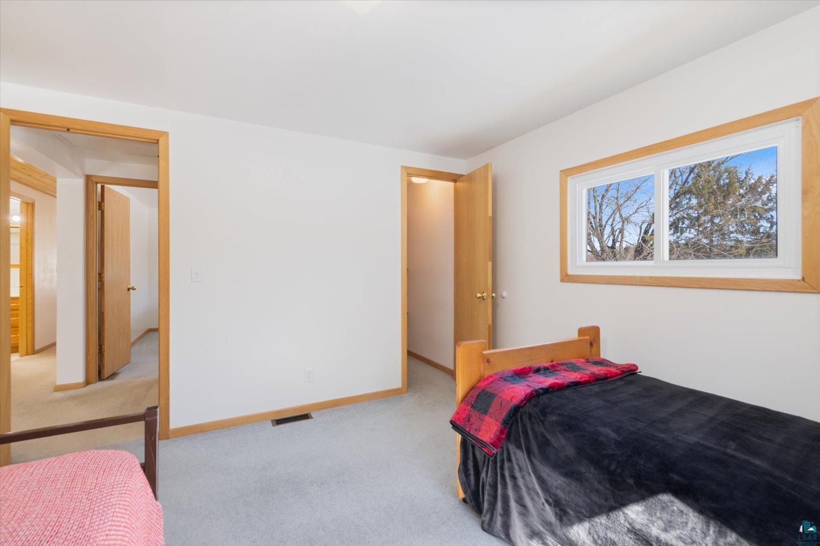 3495 Deer Forest Road Makinen, MN 55763 - Photo 53 of 71 Bedroom featuring light colored carpet and baseboards