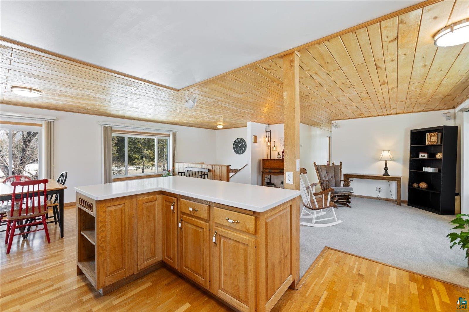 3495 Deer Forest Road Makinen, MN 55763 - Photo 71 of 71 Kitchen featuring wooden ceiling, a kitchen island, light countertops, light wood-style floors, and open floor plan