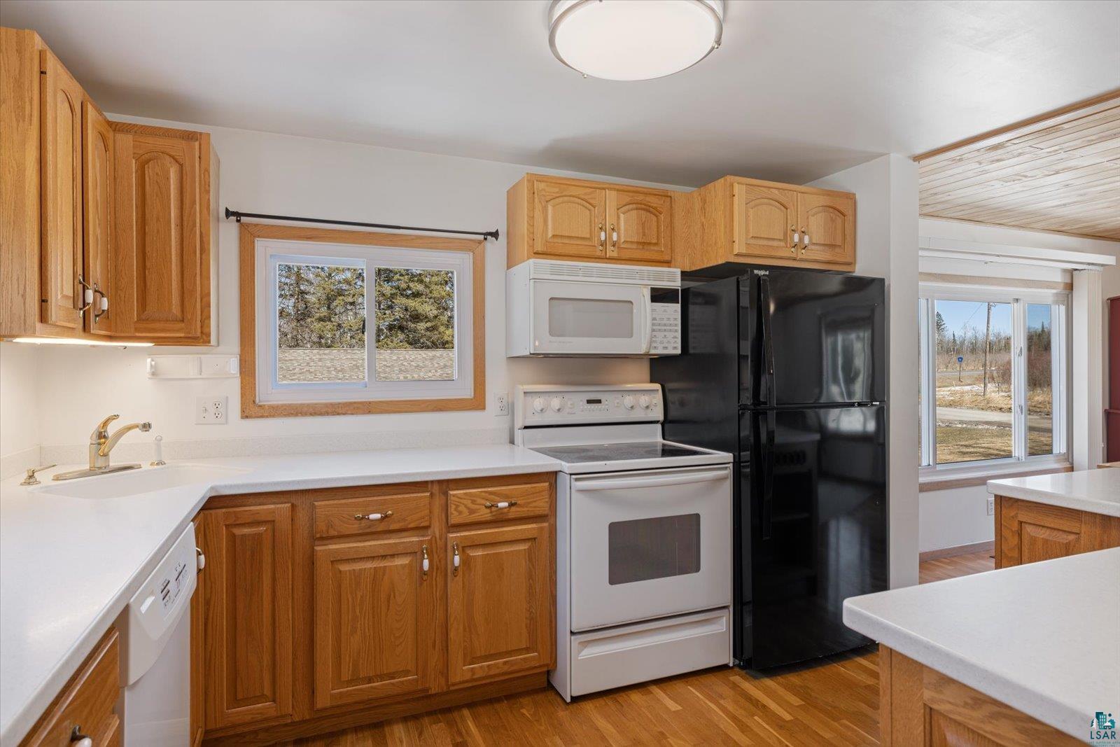 3495 Deer Forest Road Makinen, MN 55763 - Photo 58 of 71 Kitchen with white appliances, light countertops, and light wood-style floors