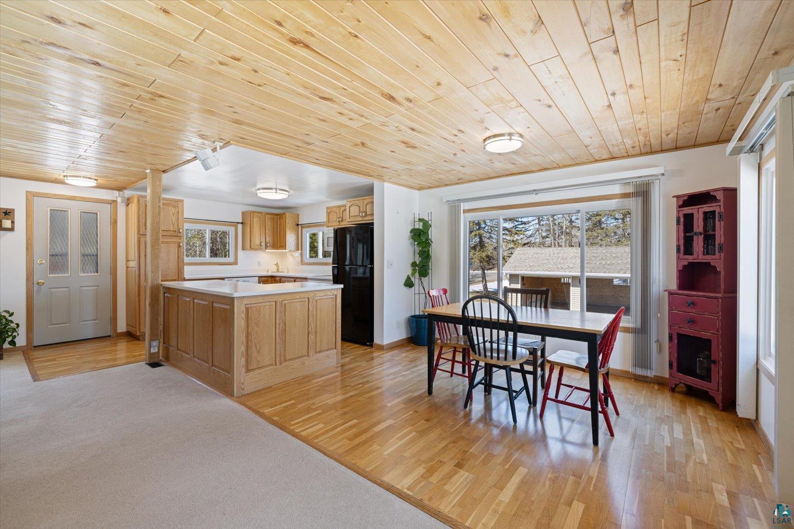 3495 Deer Forest Road Makinen, MN 55763 - Photo 59 of 71 Dining area with wood ceiling, light wood finished floors, and light colored carpet