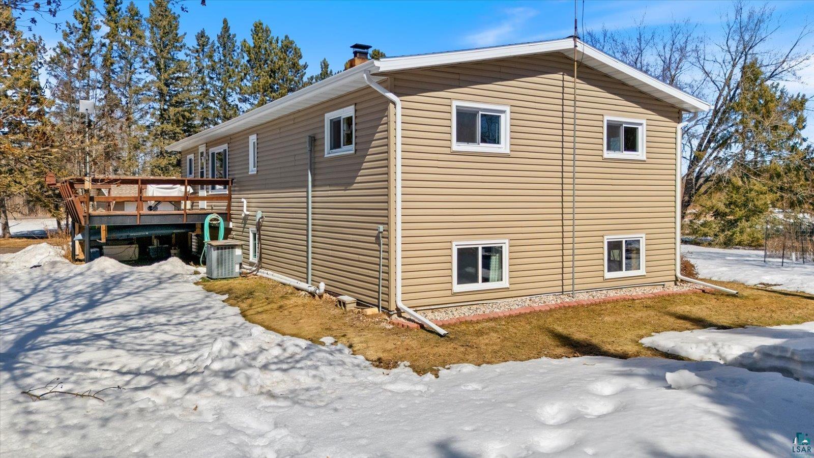 3495 Deer Forest Road Makinen, MN 55763 - Photo 68 of 71 View of snowy exterior with a wooden deck and a chimney