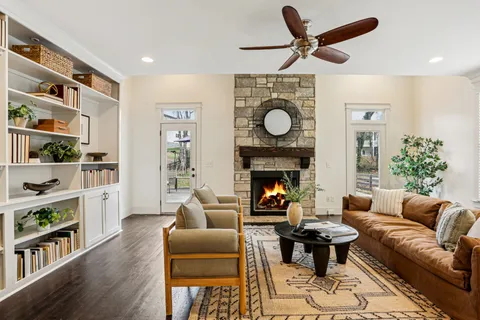 a living room with furniture and a fireplace