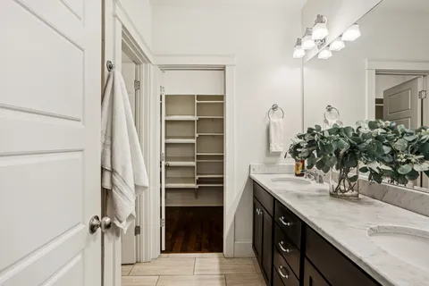 a bathroom with a sink double vanity and a mirror
