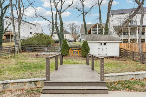 a view of a bench in the backyard