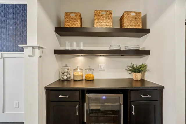 a sink with a stove and cabinets