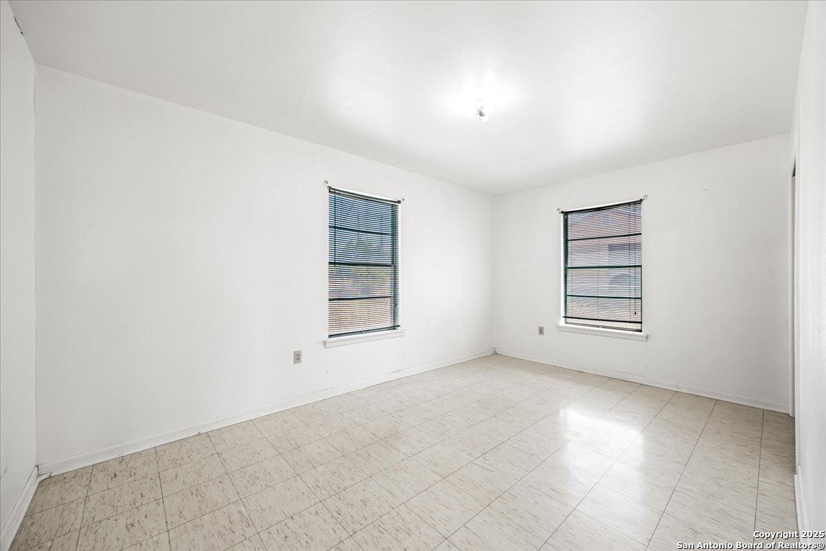 19239 McDonald Street Lytle, TX 78052 - Photo 14 of 29 an empty room with windows