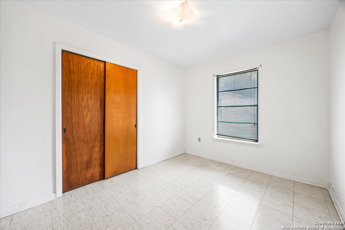 19239 McDonald Street Lytle, TX 78052 - Photo 15 of 29 an empty room with windows