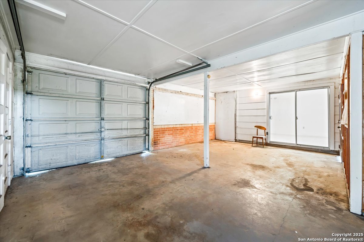 19239 McDonald Street Lytle, TX 78052 - Photo 16 of 29 a view of an empty room with cabinet and a window