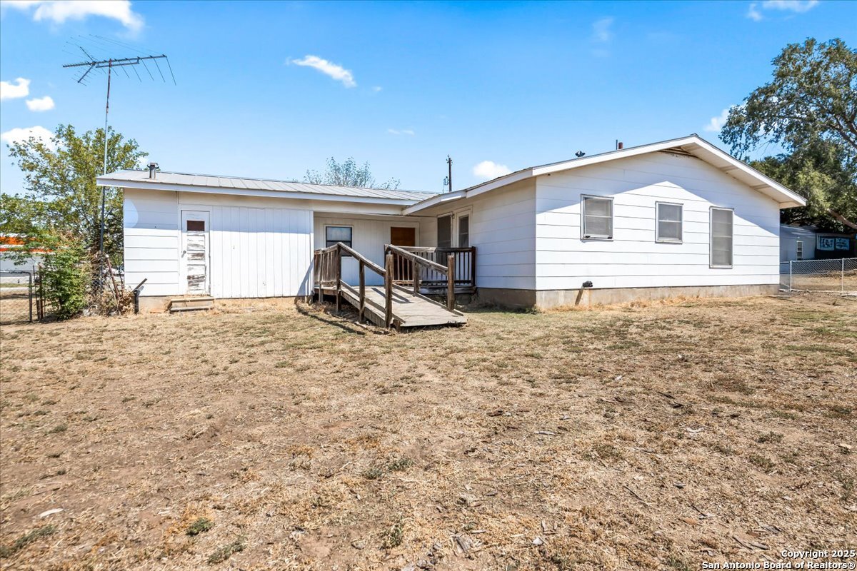 19239 McDonald Street Lytle, TX 78052 - Photo 18 of 29 a view of a house with a yard
