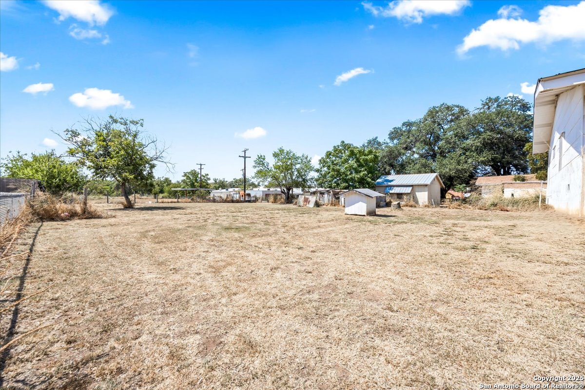 19239 McDonald Street Lytle, TX 78052 - Photo 19 of 29 a view of outdoor space with garden and trees
