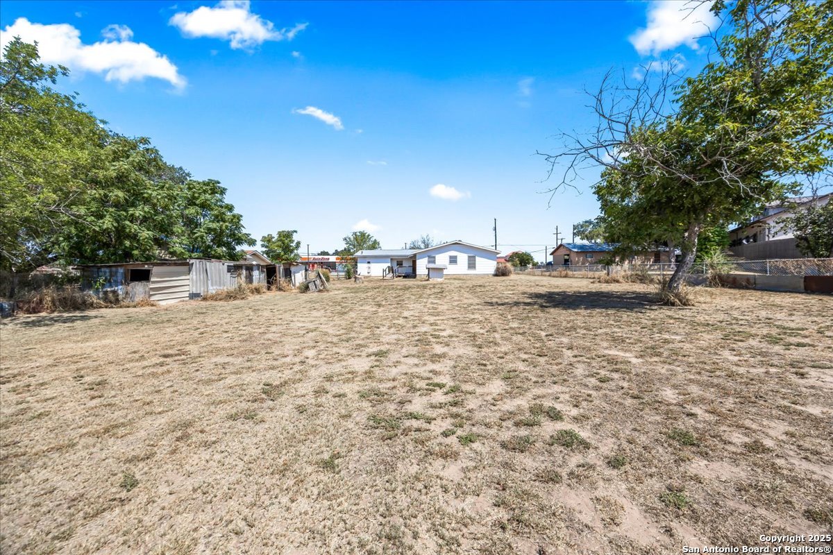 19239 McDonald Street Lytle, TX 78052 - Photo 22 of 29 a backyard of a house with table and chairs