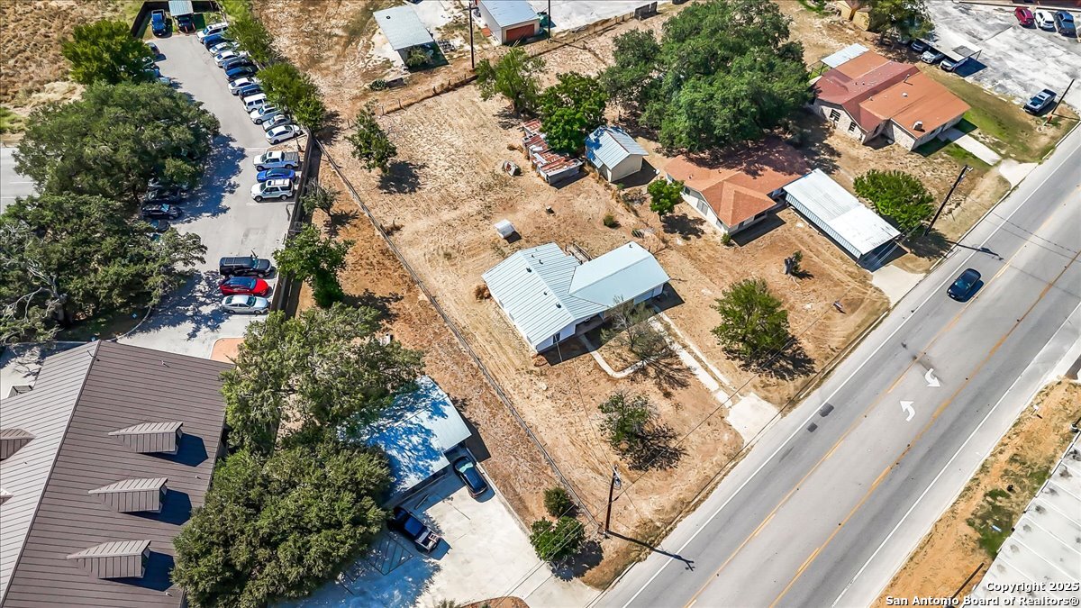 19239 McDonald Street Lytle, TX 78052 - Photo 23 of 29 an aerial view of residential houses with outdoor space