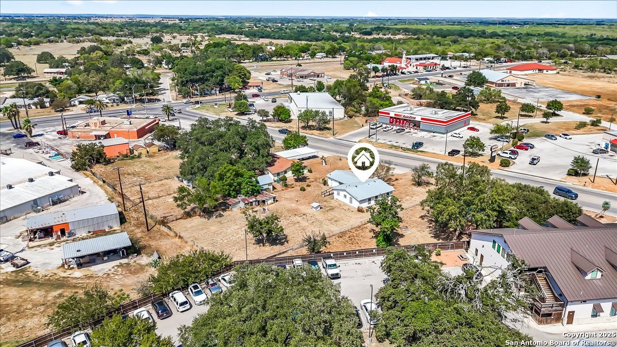 19239 McDonald Street Lytle, TX 78052 - Photo 29 of 29 an aerial view of residential houses with outdoor space