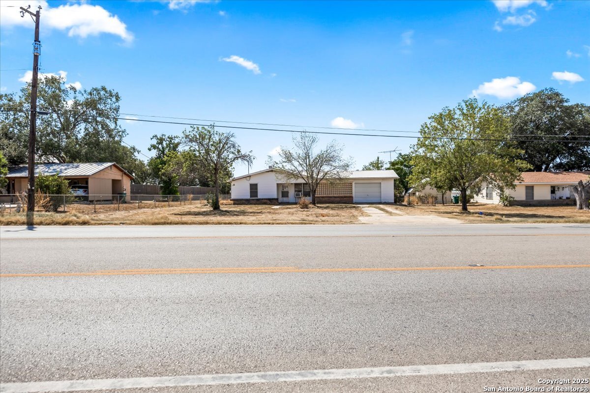 19239 McDonald Street Lytle, TX 78052 - Photo 4 of 29 a view of street with houses