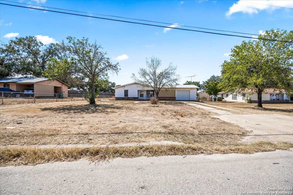19239 McDonald Street Lytle, TX 78052 - Photo 5 of 29 a view of a house with a yard