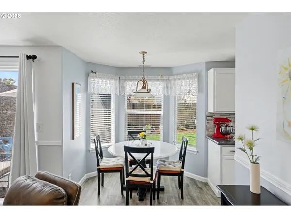 a view of a dining room with furniture window and outside view