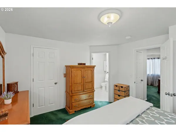 a bedroom with a bed and a cabinets