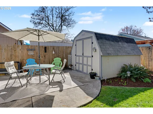 a view of a patio with furniture and table