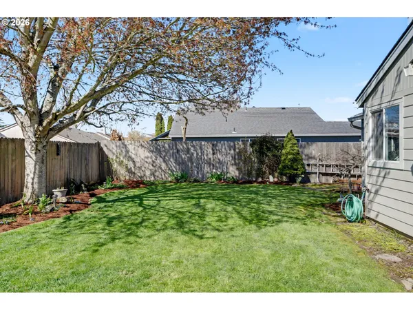 a backyard of a house with lots of green space