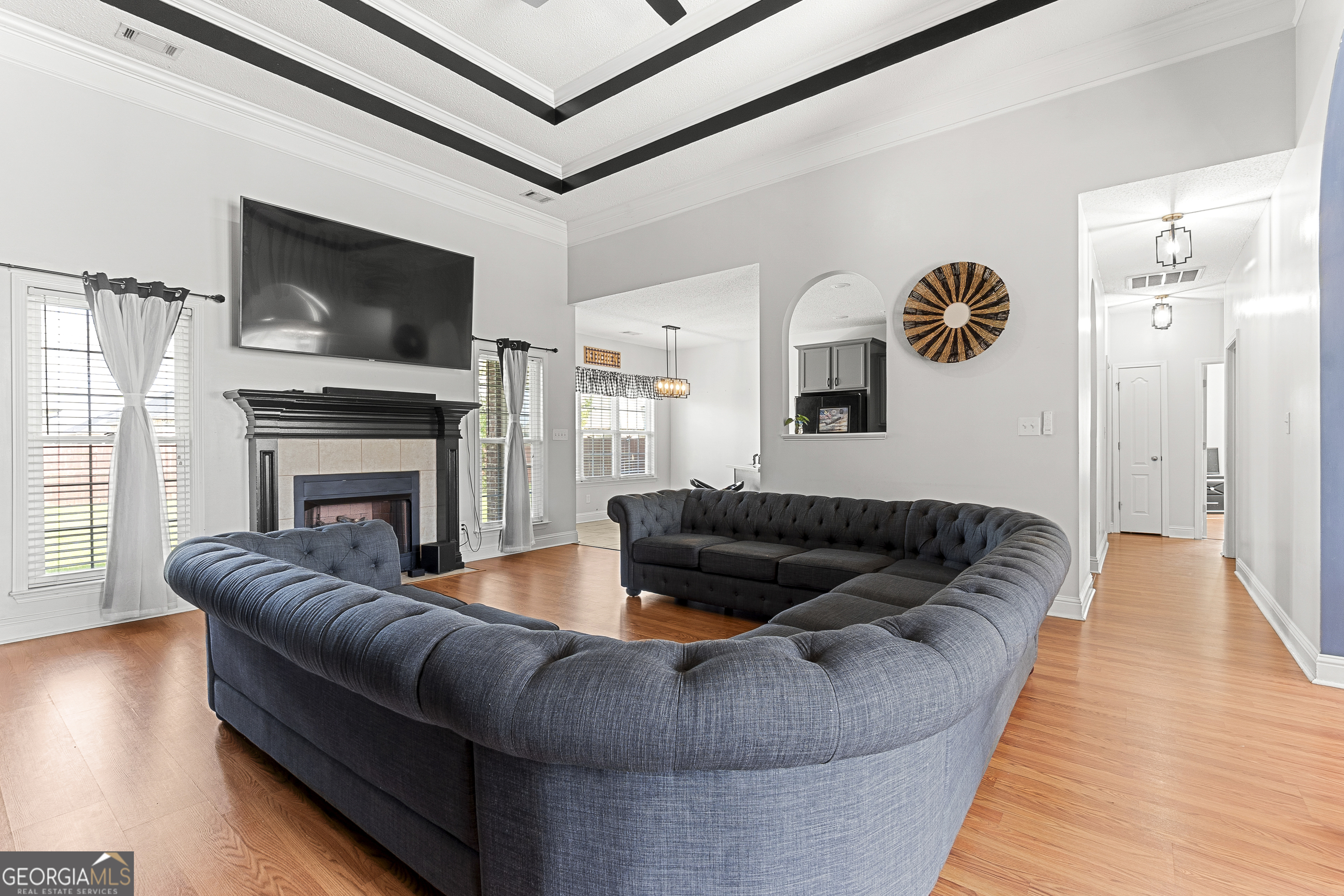 217 Caleb Way Byron, GA 31008 - Photo 13 of 58 a living room with furniture flat screen tv and a fireplace