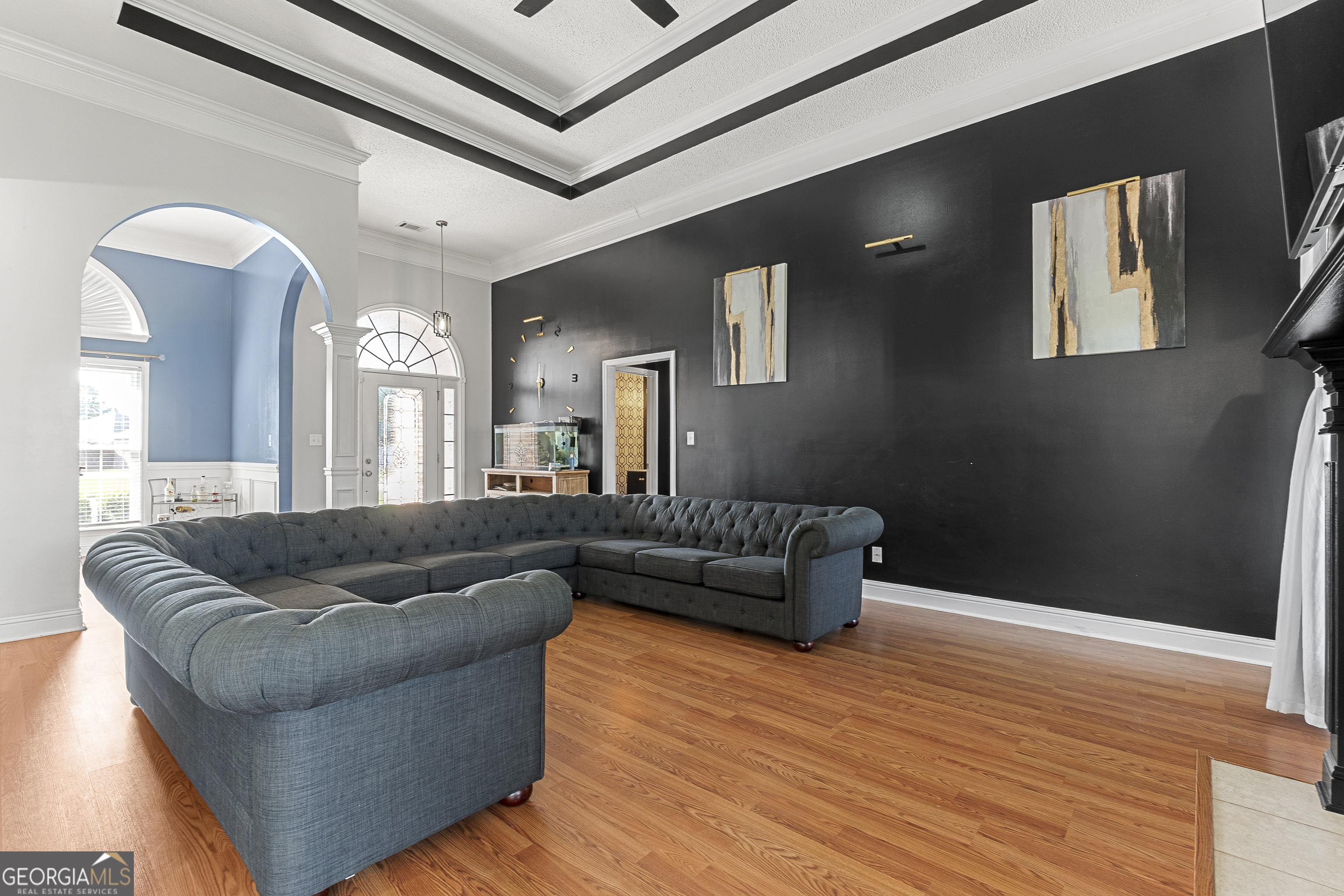 217 Caleb Way Byron, GA 31008 - Photo 14 of 58 a living room with furniture and a wooden floor