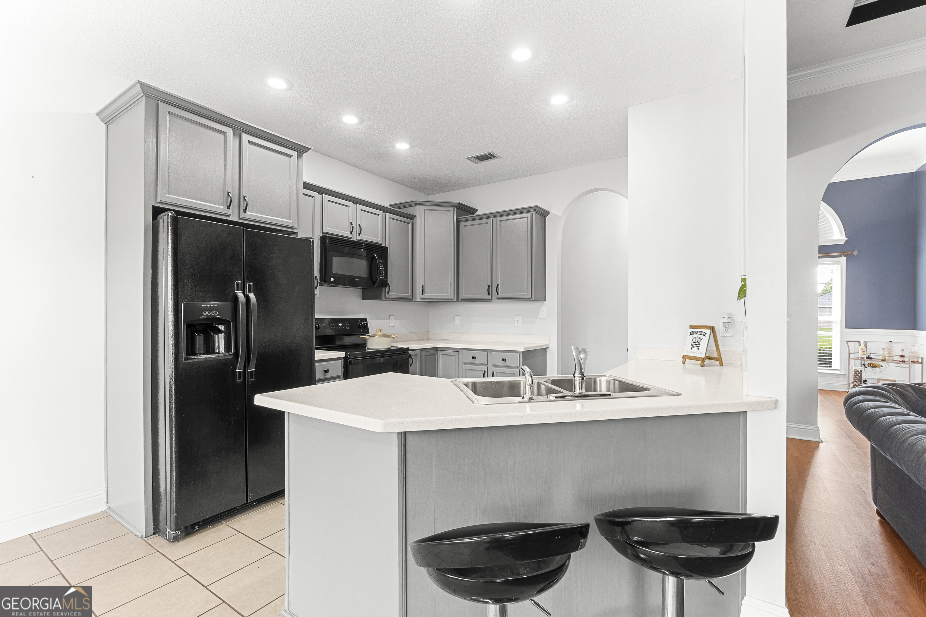217 Caleb Way Byron, GA 31008 - Photo 19 of 58 a kitchen with stainless steel appliances a refrigerator and a sink