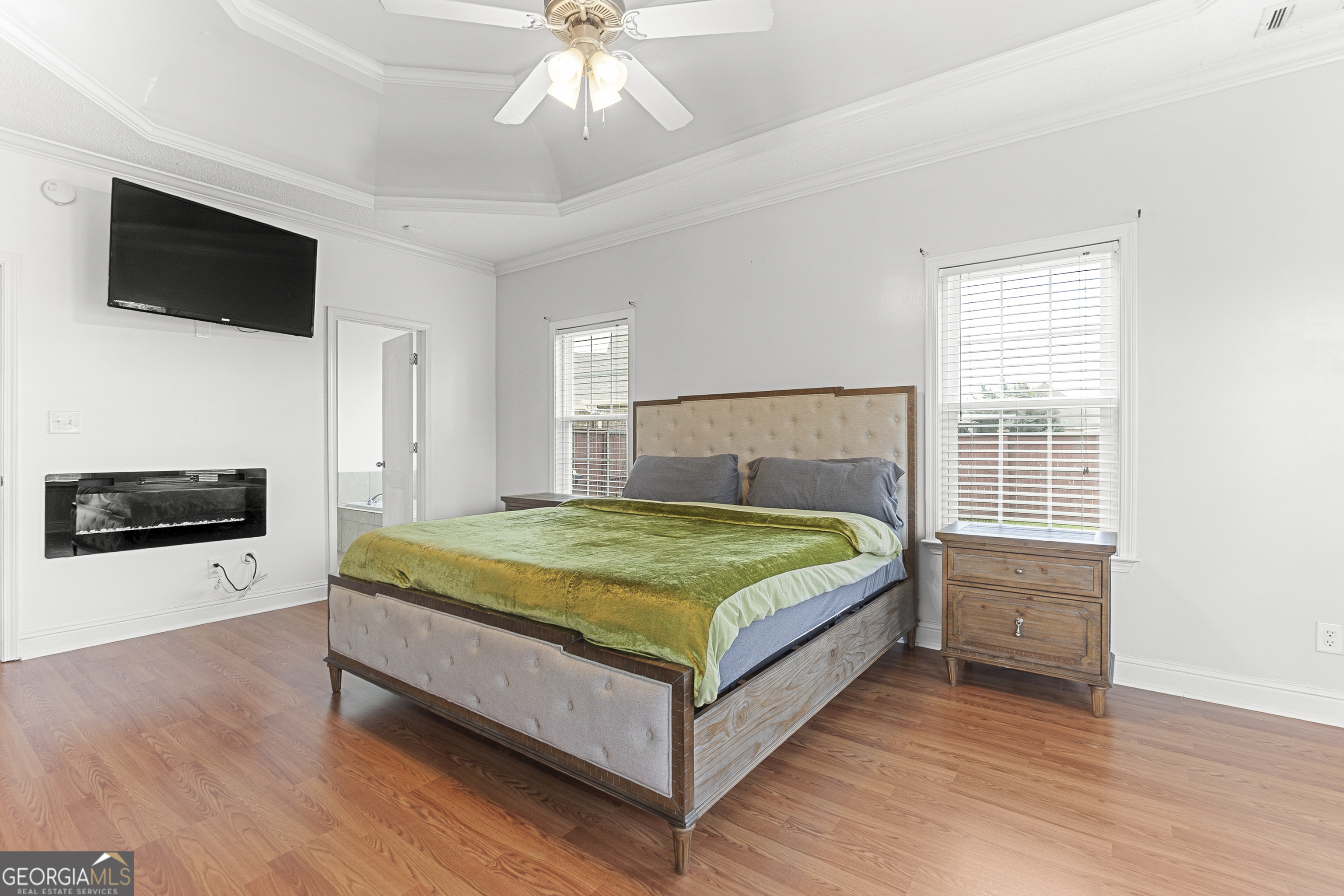 217 Caleb Way Byron, GA 31008 - Photo 29 of 58 a bedroom with a bed and a flat screen tv