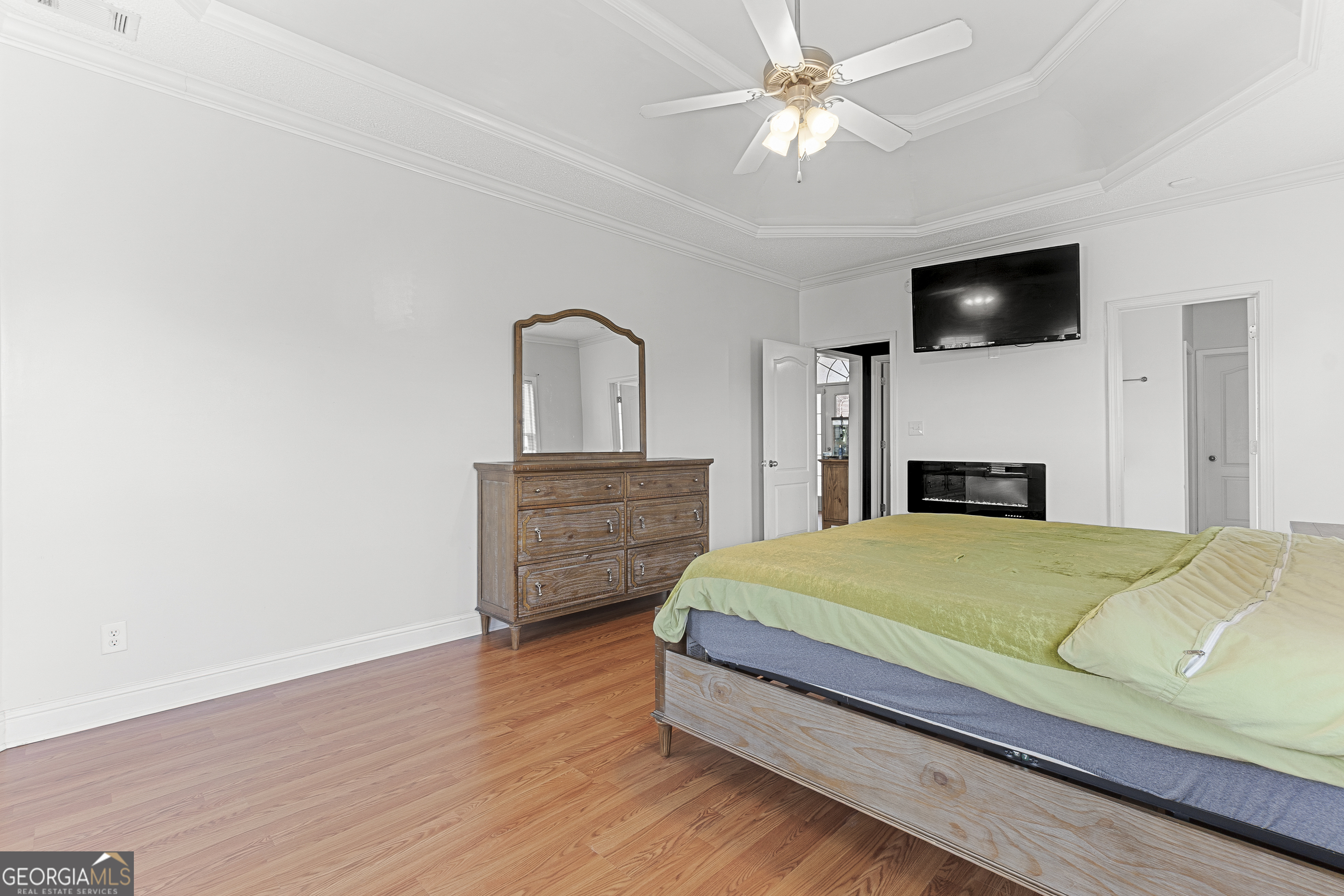 217 Caleb Way Byron, GA 31008 - Photo 30 of 58 a room with a bed and a television