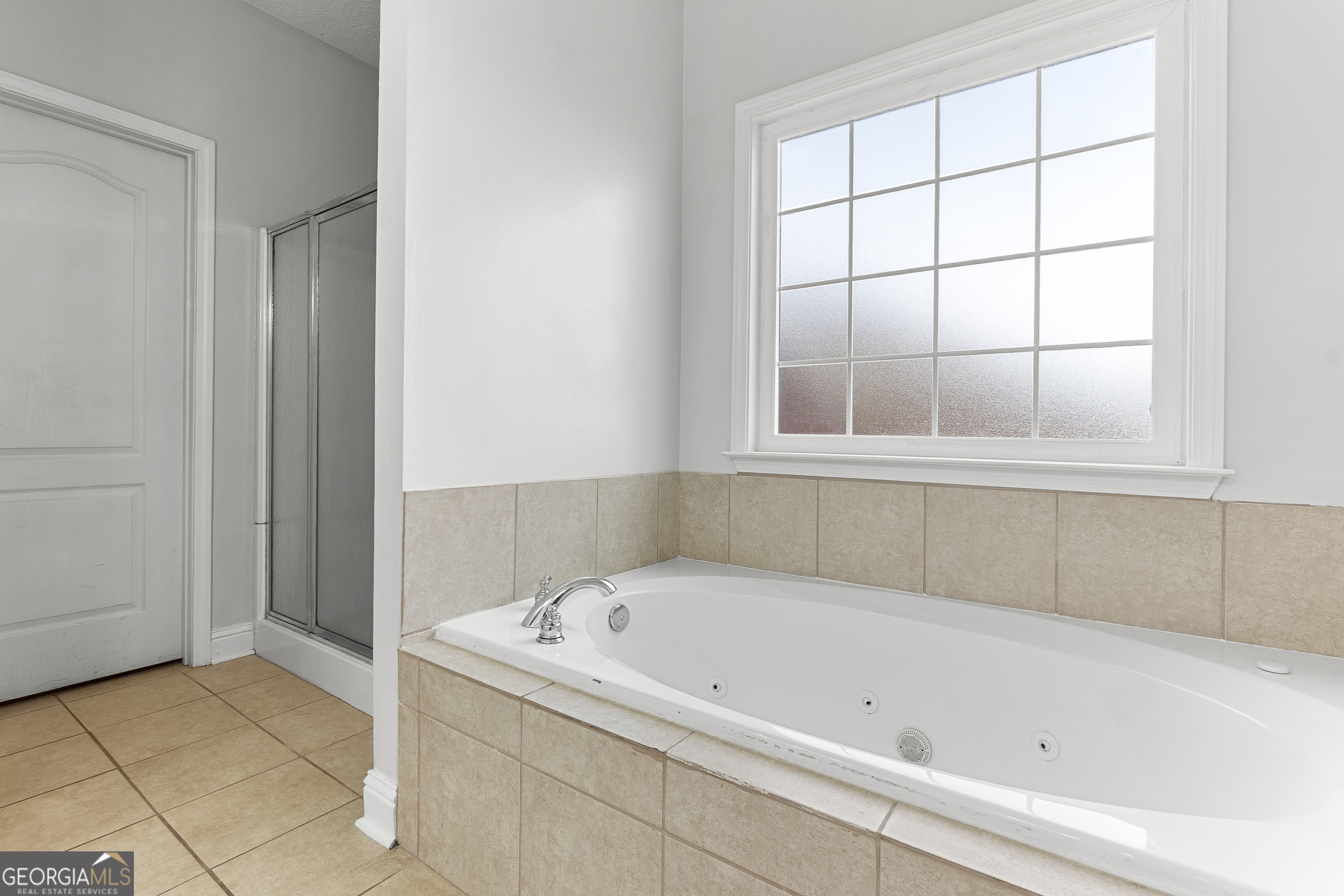 217 Caleb Way Byron, GA 31008 - Photo 36 of 58 a white bath tub sitting next to a window