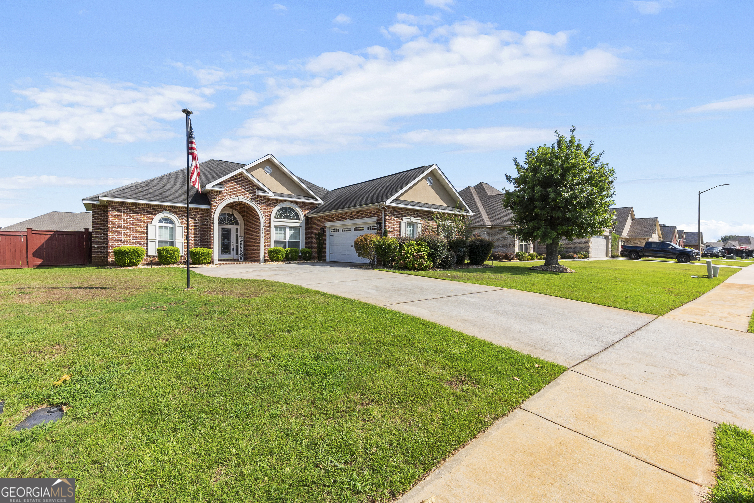 217 Caleb Way Byron, GA 31008 - Photo 4 of 58 a front view of a house with a yard