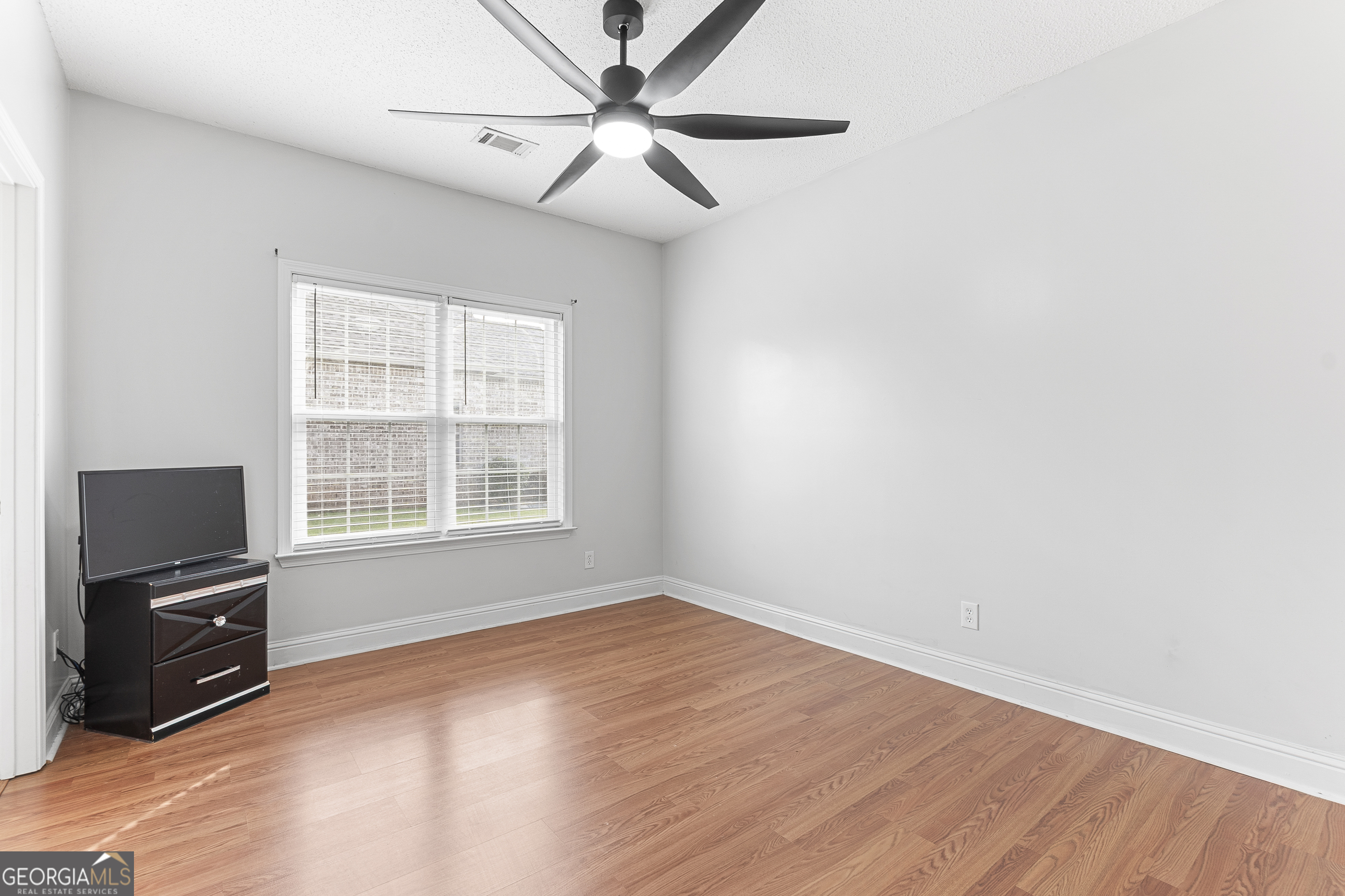 217 Caleb Way Byron, GA 31008 - Photo 42 of 58 a view of a livingroom with a flat screen tv
