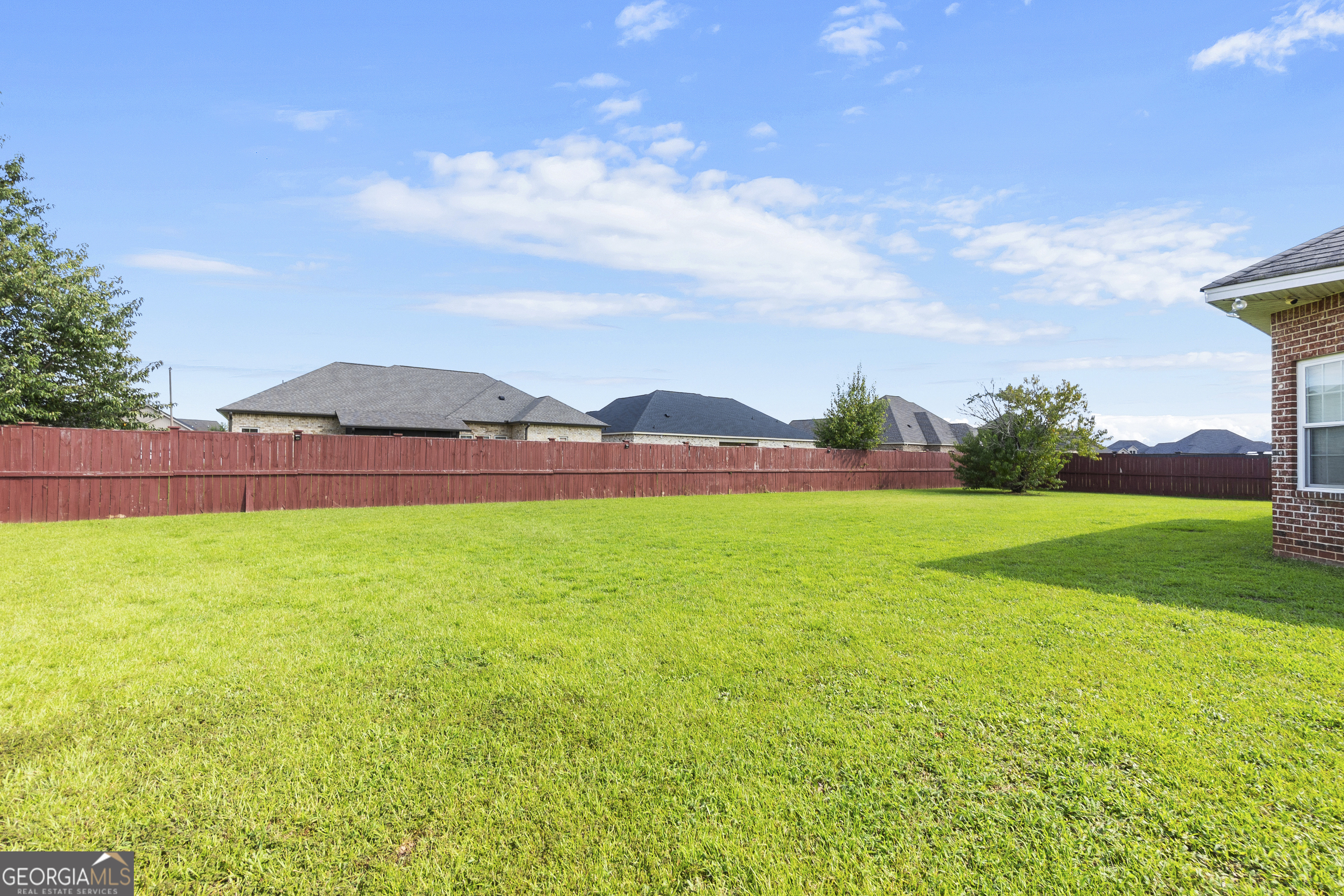 217 Caleb Way Byron, GA 31008 - Photo 50 of 58 a view of green field with house in the background