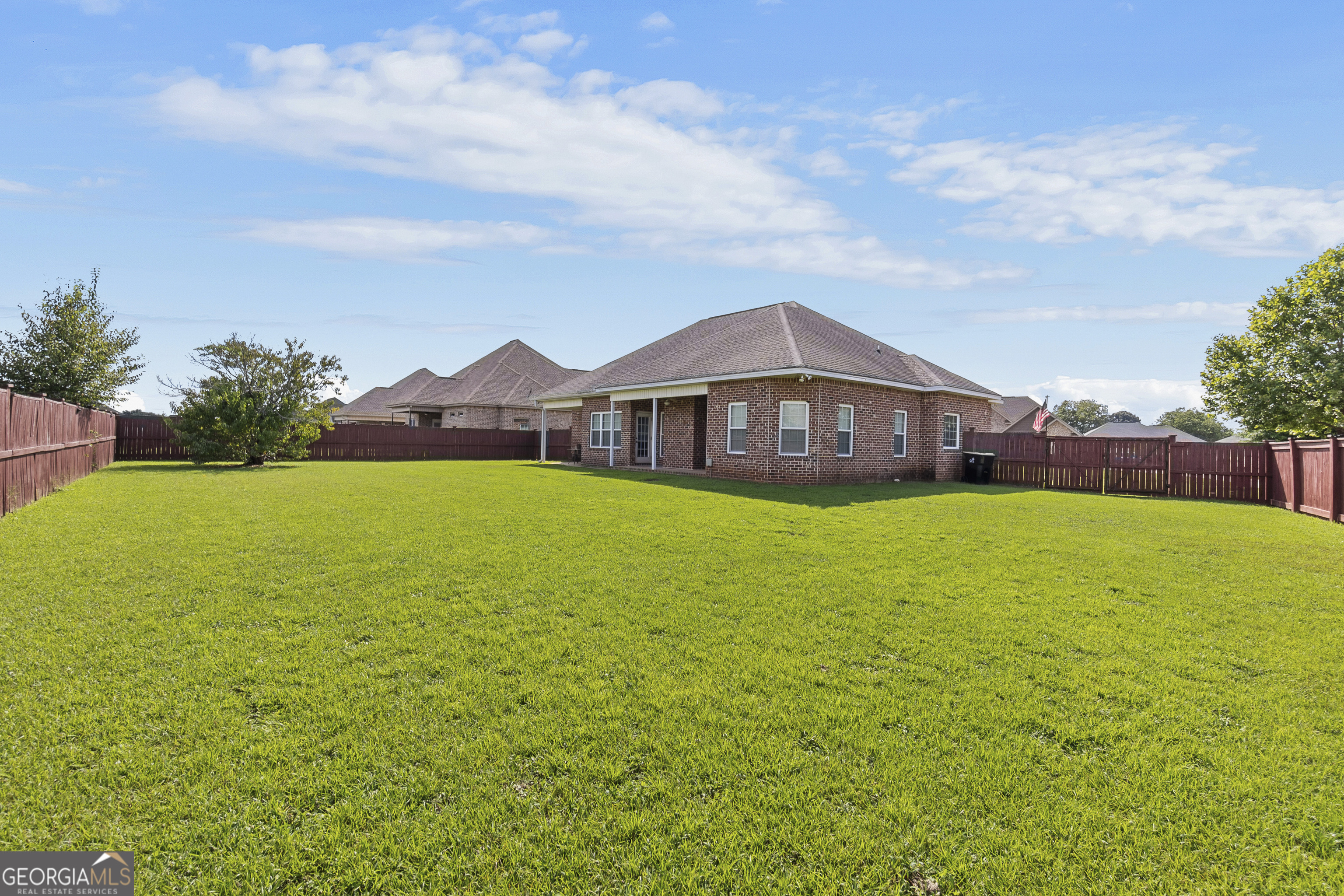 217 Caleb Way Byron, GA 31008 - Photo 51 of 58 a view of a house with a garden and a yard